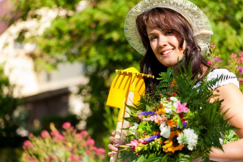 Garden maintenance tools and neat planting in Plumstead home garden