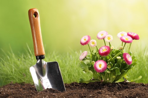 Gardening staff managing a work area with clear safety precautions